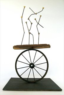 A Fine Balance [2007] driftwood, brass gas fittings, wheel + steel 55 x 31.5 x31.5 cm